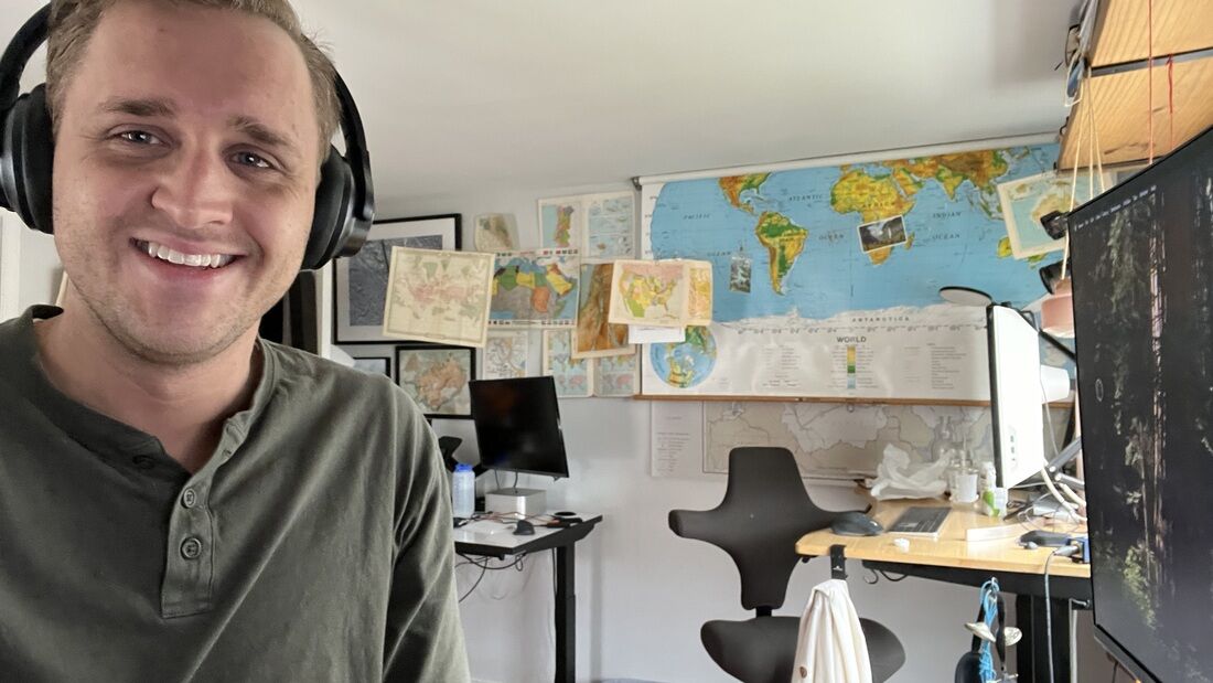 Ryan at his desk, the map wall behind him